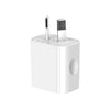 A white compact dual-port USB wall charger with two cylindrical charging ports.