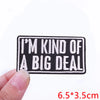 Black embroidered iron-on letter patch with white text that reads I'M KIND OF A BIG DEAL