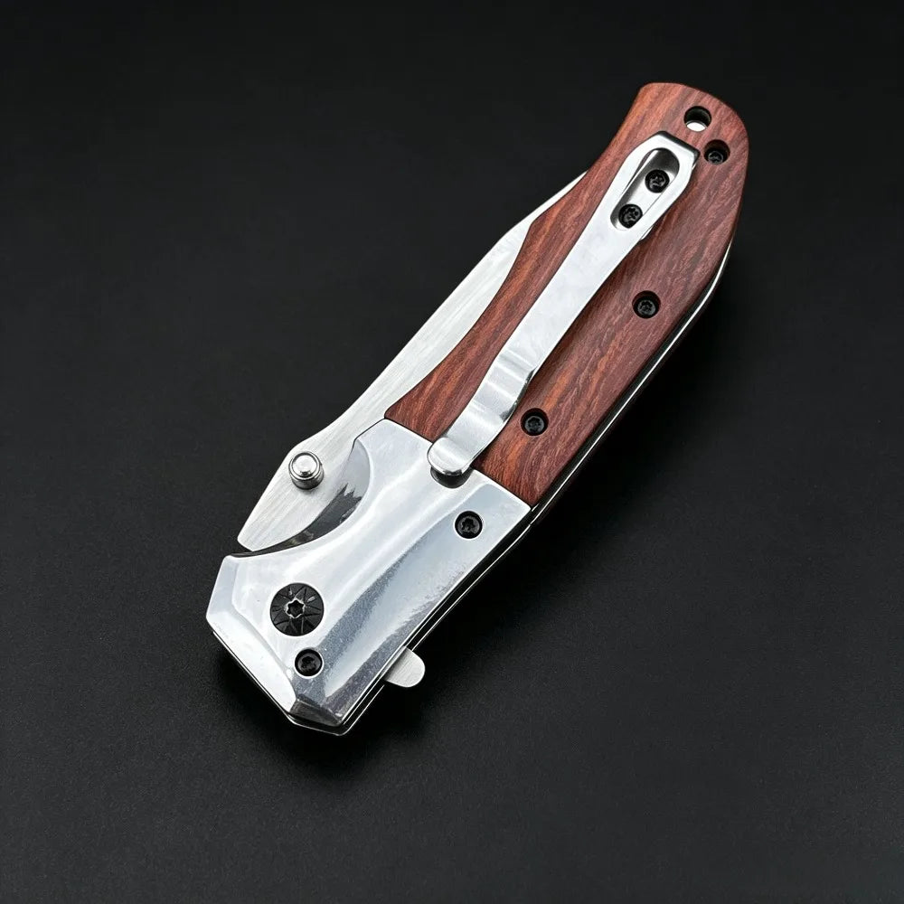 A folding pocket knife featuring a walnut wood handle and stainless steel blade, shown against a dark background.