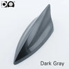A sleek, dark gray shark fin car antenna with a glossy finish.