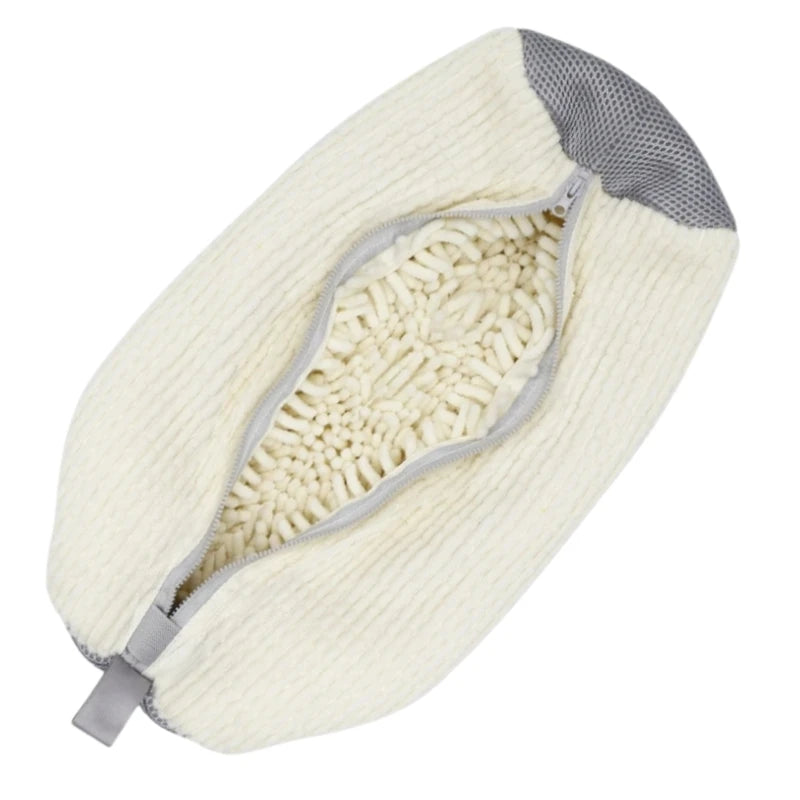 A cream-colored shoe washing machine bag with a gray lining and a soft cleaning brush visible.