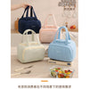 A collection of pastel insulated quilted lunch tote bags in various shades including blue, pink, and cream.