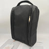 A black breathable oxford cloth shoe storage bag with a top handle and zipper.