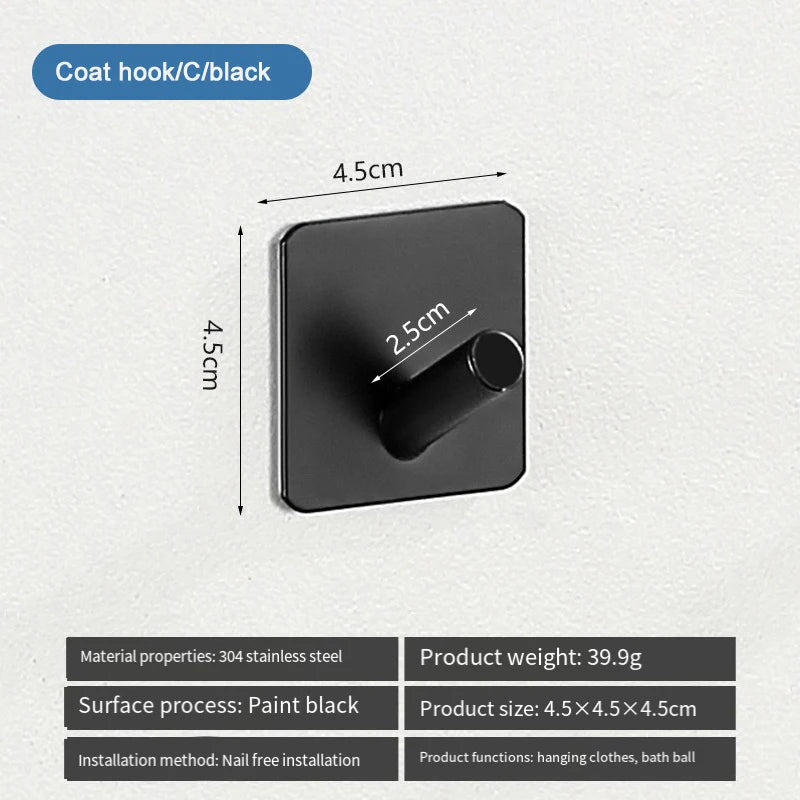 A black coat hook with a cylindrical handle mounted on a wall, designed for hanging clothes.