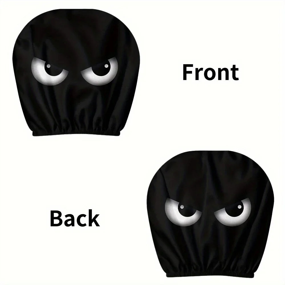 A pair of black slanted eyes car headrest covers shown from the front and back views.