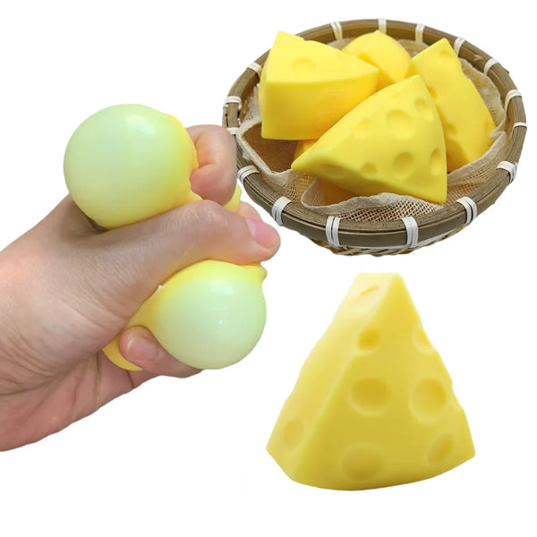 Yellow cheese squishy toys are shown in a woven basket and being held by a hand.