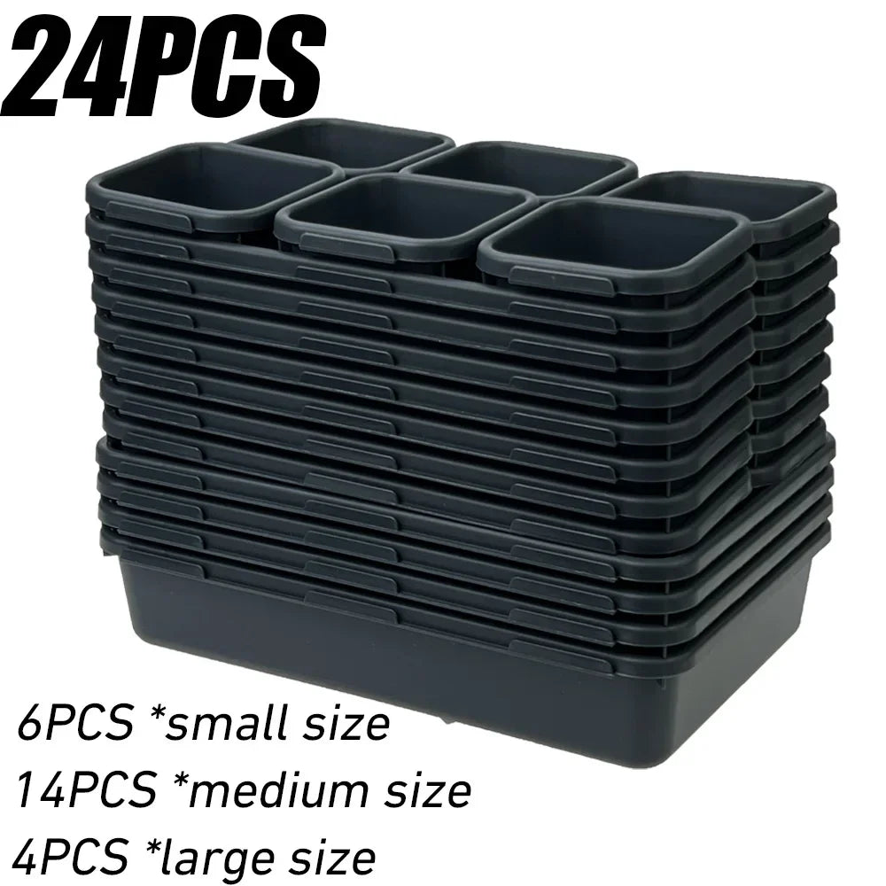 A stack of black modular drawer organizer trays with interlocking dividers, showing sizes for small, medium, and large capaci