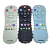 Three silicone baby teethers in green, black, and light blue with various shapes and buttons