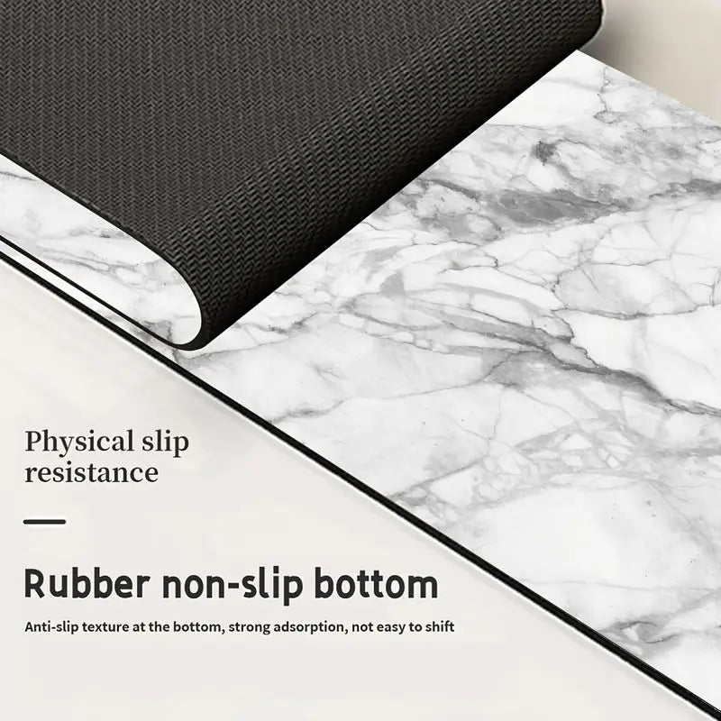 Black rubber non-slip bottom mat placed on a white marble surface.