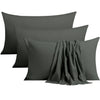 A set of four solid gray microfiber pillowcases with envelope closures stacked together.