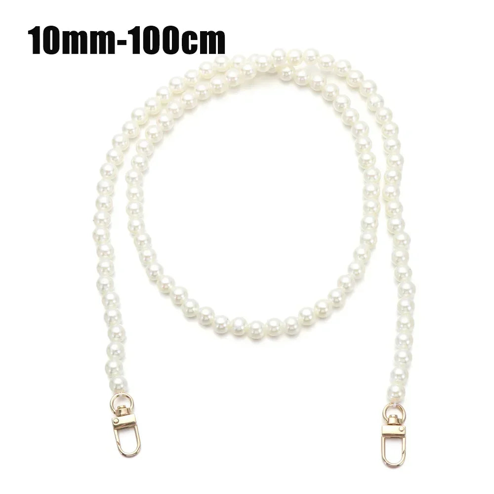 A strand of white pearls used as an elegant chain strap for handbags or DIY purses.