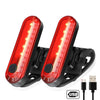 A pair of red LED bicycle tail lights with USB charging ports shown against a white background.