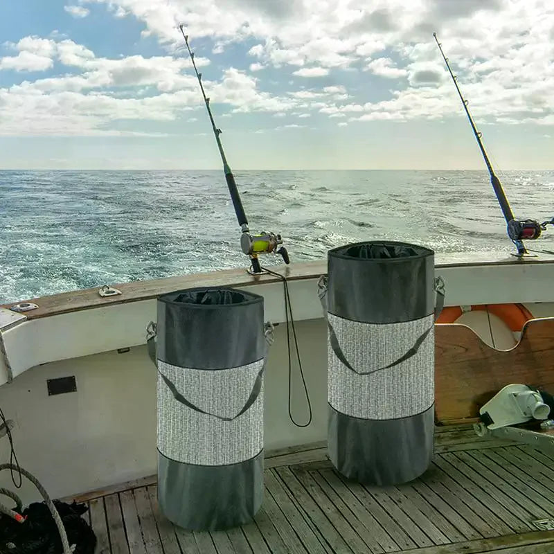 Two cylindrical mesh trash bags mounted on a boat deck with fishing rods in the background