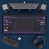 A large mouse pad with a mechanical keyboard, headphones, and mouse visible on a dark surface.