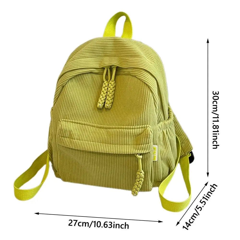 A light olive green corduroy casual backpack with yellow straps and a drawstring closure.