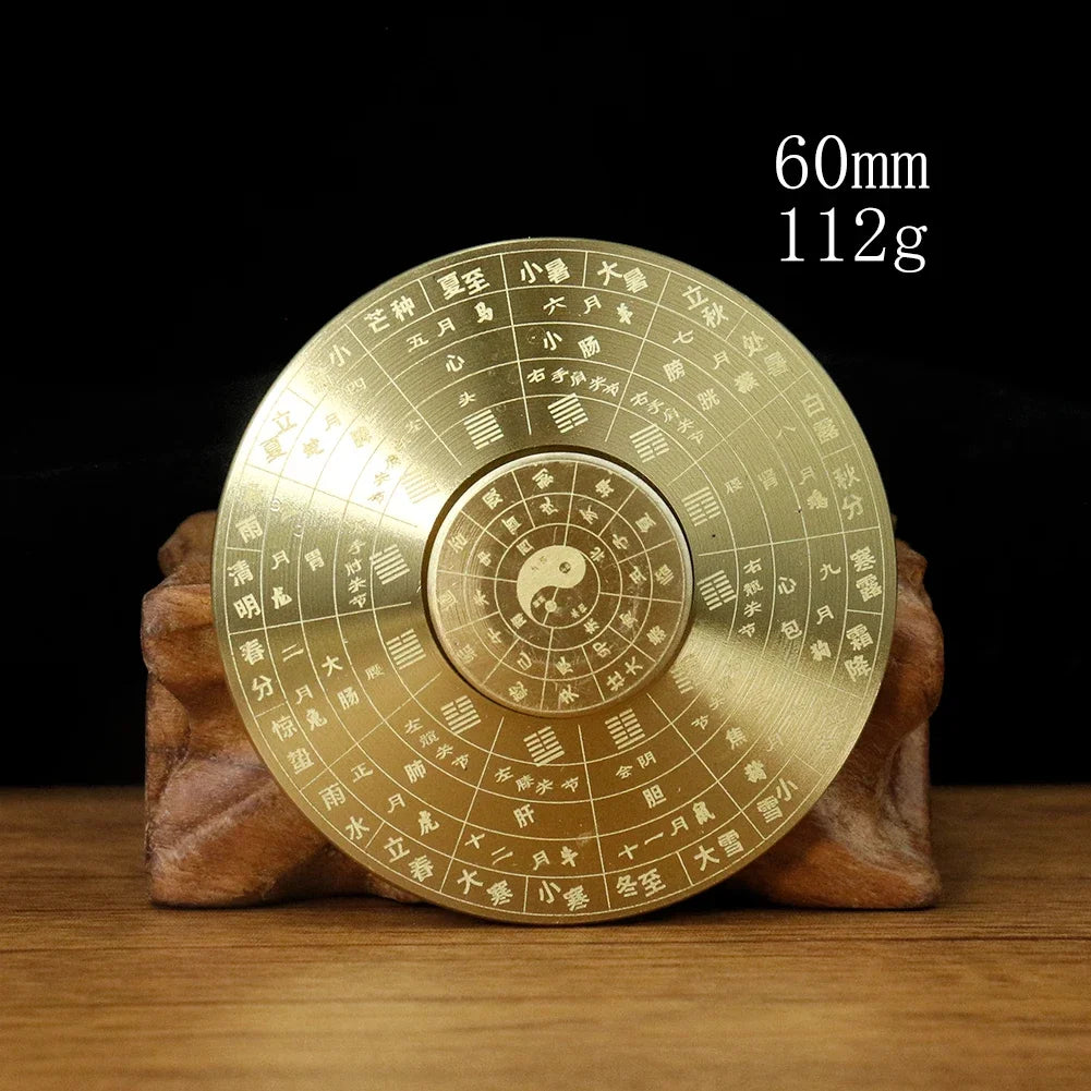 Solid brass Feng Shui compass with Yin Yang and eight trigrams, measuring 60mm and weighing 112g.