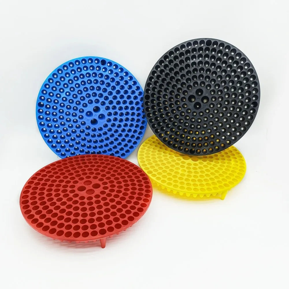 Three circular grit guard inserts for car wash buckets in blue, black, and yellow.