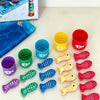 A set of colorful fabric fish and numbered containers for a Montessori fishing game for toddlers.