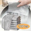 A hand is holding a stack of 10 reusable steel wire scrubber dishcloths, showing the mesh texture and gray color.