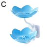 A light blue two-tier bathroom storage rack featuring lotus-shaped bowls with drainage holes.