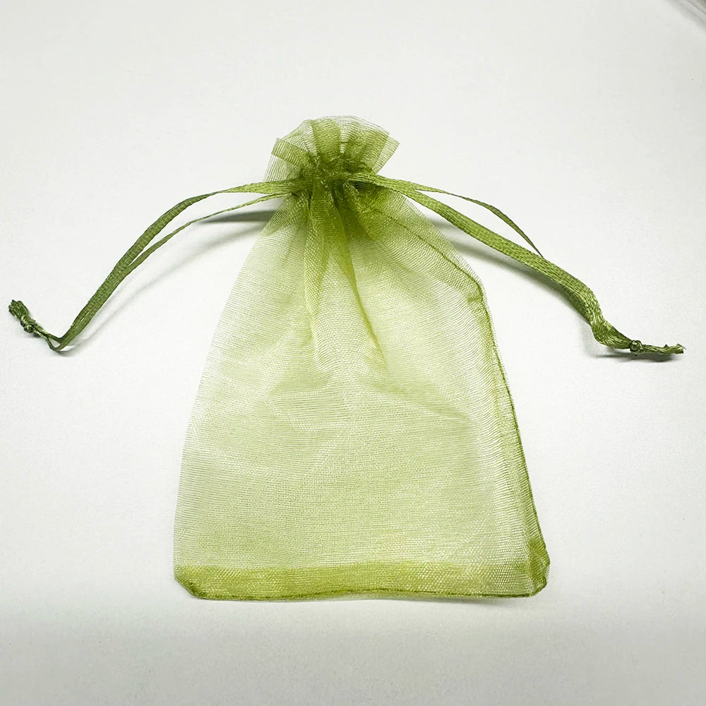 A sheer lime green organza drawstring bag tied at the top, displayed against a white background.