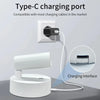 A white magnetic rechargeable touch light with a charging port is shown plugged into a wall outlet.