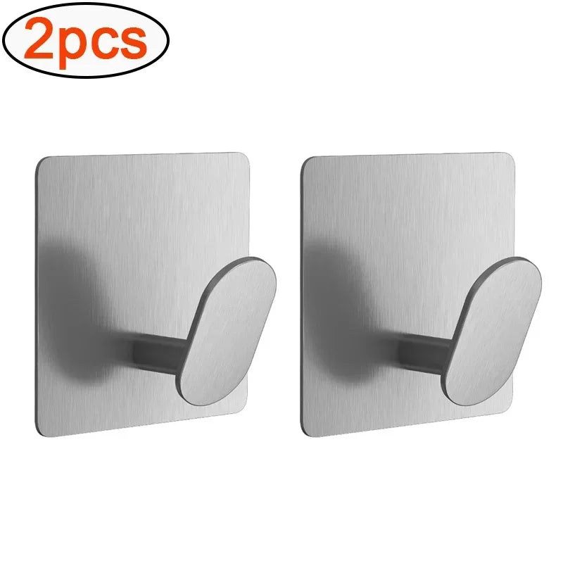 Two silver adhesive stainless steel robe hooks for no-drill wall mounting.