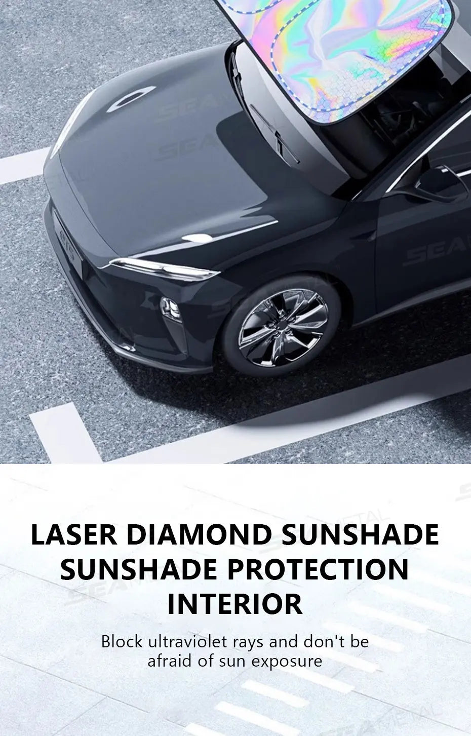 A close-up of a black car with a clear, iridescent laser diamond sunshade installed on the windshield.