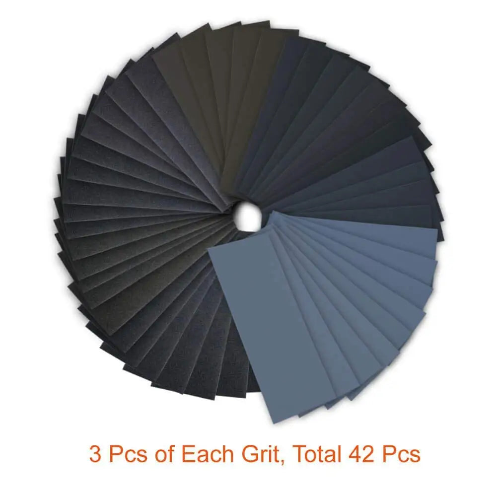 A circular display of 42 pieces of wet/dry sandpaper in various shades of gray and black.