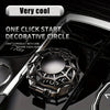 A close-up of a decorative metal circle used as a one-click start cover for a vehicle ignition.
