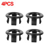 A set of four black chrome-plated sink overflow covers or stoppers.