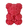 A pink 3D rose bear silicone mold used for crafting candles, soap, and resin