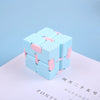 A light blue infinity magic cube fidget toy resting on a white surface.