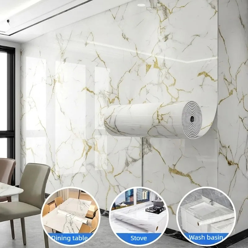 Roll of gold foil marble peel-and-stick wallpaper displayed on a white marble wall with kitchen fixtures.