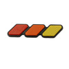 A set of three colored, rectangular grille emblem stickers in red, orange, and yellow.