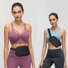 A female model wearing a purple sports bra and matching leggings with a black nylon waist pack.