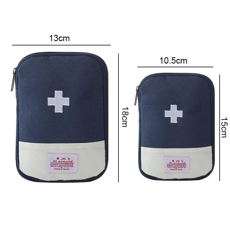 Navy blue portable mini first aid kit organizer bag with a white cross and pink label