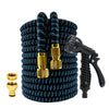 A coiled black garden hose with a gold-colored high-pressure nozzle and fittings.
