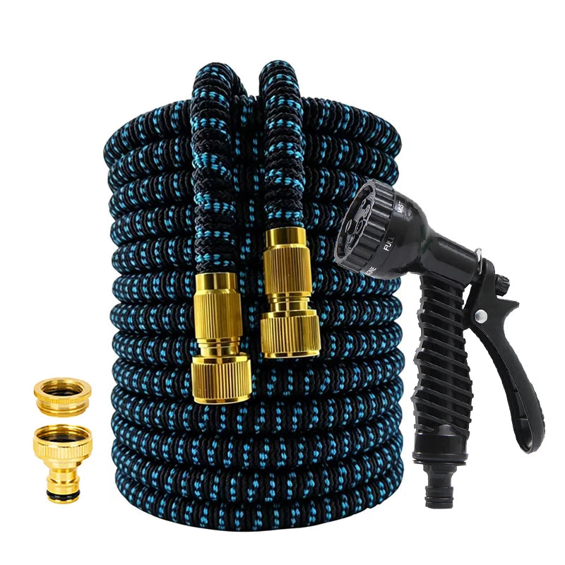 A coiled black garden hose with a gold-colored high-pressure nozzle and fittings.