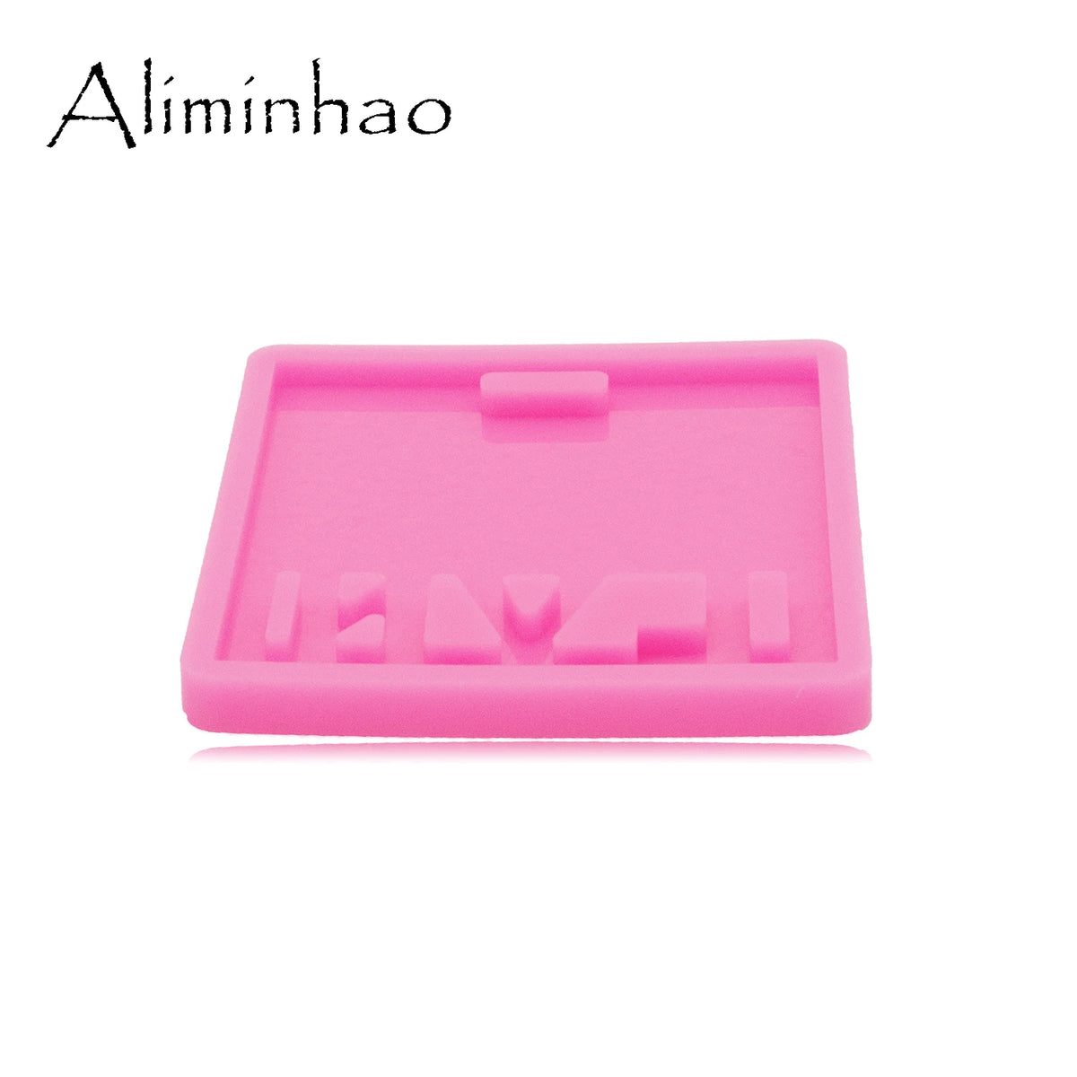 A pink silicone resin mold with various shapes for making badge backings and keychains.