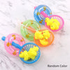 A collection of colorful squeaky rubber duck bath toys in various shades including pink, blue, green, and orange on a white m