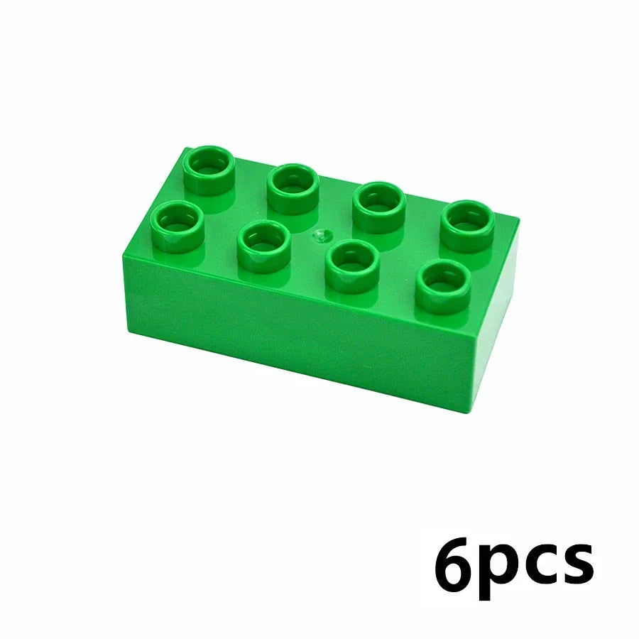 A green building block set containing six circular blocks.