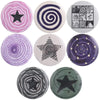 A collection of ten tinplate pin brooches featuring various designs including stars, spirals, and animals.