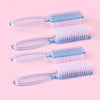 A set of four nail art brushes with long handles and blue bristles displayed on a pink background.