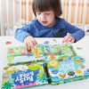 A child is interacting with a colorful Montessori quiet book featuring interactive word recognition activities.