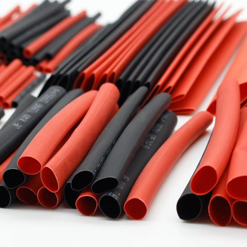 Assortment kit of 127 heat shrink tubing in red and black colors, showing various sizes and shapes.