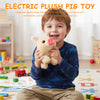 A young boy is smiling while holding a yellow plush pig toy.