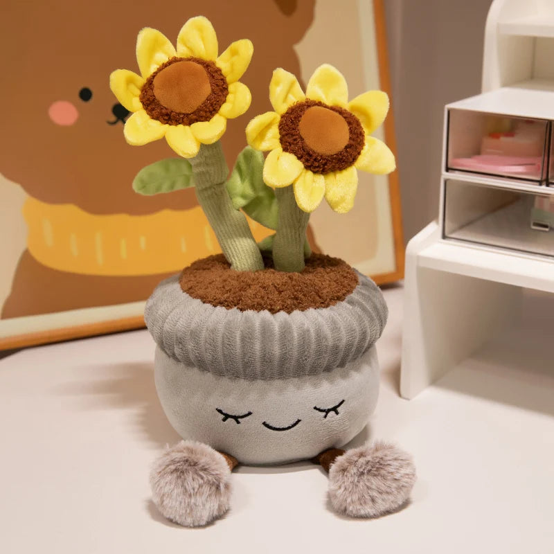 A cute artificial flower plush doll with yellow petals and a green stem, sitting on a gray plant pot.