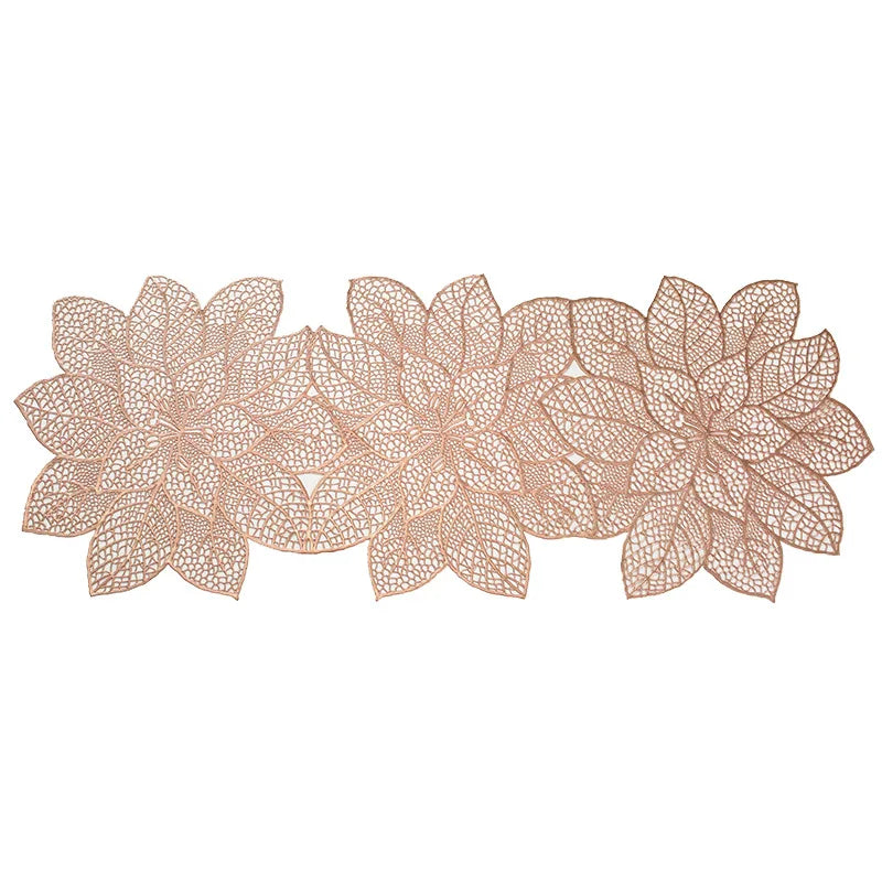 A set of ornate, light brown PVC table runners and placemats featuring intricate floral designs.