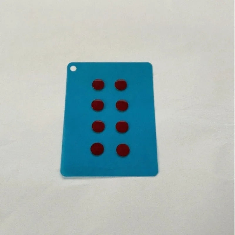 A rectangular blue glass mouse skate with six red dots on a white background.